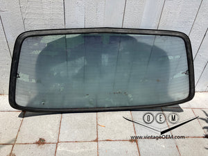 77-85 Mercedes Benz W123 Rear Windshield glass with frame and seal 1236701380